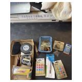 Razor blades, tape measure, push pins and ceiling