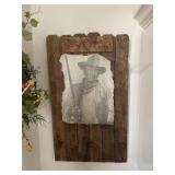 John Wayne photo on wood and wreath