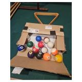 Set of pool balls and rack