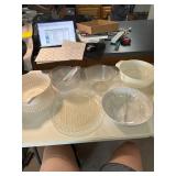 2 large strainers, plastic bowls with 4 plastic