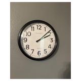 Clock and wall art in office