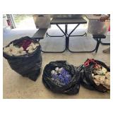 2 bags of faux flowers and a wreath