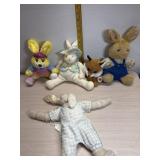 4 stuffed rabbits and fox