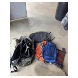 Duffle bags and backpacks and a quiver