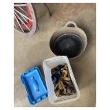 Tote of tie down straps and feed trough