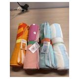 4 new beach towels- 3 kids and 1 other