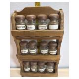 12 Spice bottles, wood tops and rack