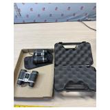 2 small pair on binoculars and Revolver case