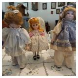 3 dolls on stands
