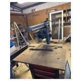 Craftsman Radial Arm Saw on a tool box works