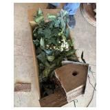 Box of faux plants and birdhouse
