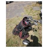 Golf clubs and cart