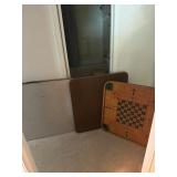 2 folding tables and a vintage game board