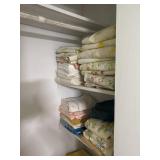 Closet in front bedroom clothes and linens brings
