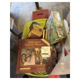 Lg tote of puzzles and games and creeper stool