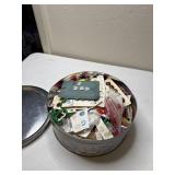 Tin of buttons