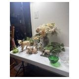 Floral arrangement. Candle wall sconces, cows and