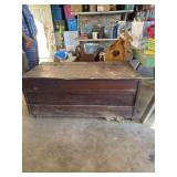 Large wood trunk on wheels with contents