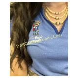 2 necklaces - In a zipper purse embrodered with