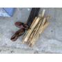 bundle of rebar, wood stakes, men's shoes