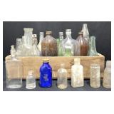 Vintage Glass Bottles in Old Wood Crate