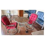 2 swivel patio chairs and patio table