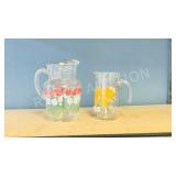 2 vintage glass juice jugs