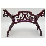 Dark Wooden Sculpture Depicts a Stylized Horses
