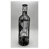 black metal wine bottle-shaped cork holder