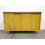 Distressed yellow cabinet with sliding doors