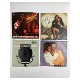 4 Vinyl Records With Sleeves