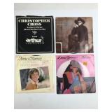Four 7-Inch Vinyl Records
