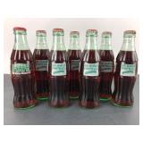 7 Coca-Cola Commemorative Bottles
