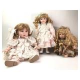 3 Porcelain Dolls In Detailed Dresses