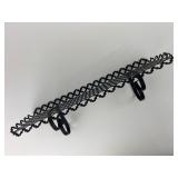 Black Metal Shelf With Decorative Cutouts