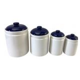Set of Four White and Blue Ceramic Canisters