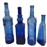 Set of Four Cobalt Blue Glass Decorative Bottles