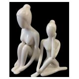Pair of Stylized White Ceramic Figurines