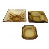 Set of Three Amber Glass Ashtrays