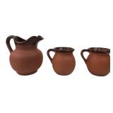 Set of Three Glazed Terracotta Pitchers