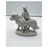 Bisque Figurine of Child on Dog