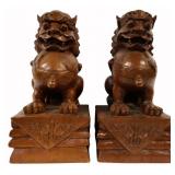 Pair of Chinese Carved Wood Foo Dogs on Pedestals.