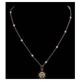 JEWELRY. 12.5kt Sun Pendant and 13.5kt Gold and