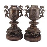 Pair of Japanese Bronze Urns on Pedestal Bases.