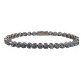 JEWELRY. 18kt Gold and Blue Gem Line Bracelet.