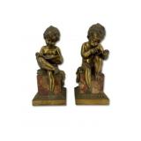 A Pair Of Bronze & Marble Seated Children Reading