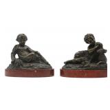 Pr of Bronze Reclining Children on Marble Bases.