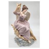 Quality porcelain angel with conch shell