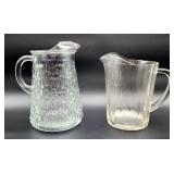 Two vintage glass pitchers