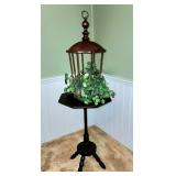 Wooden side table and bird cage decor